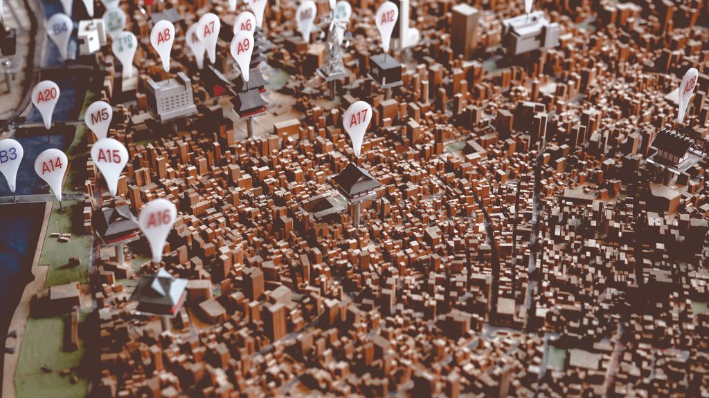 View of a city model with individual buildings on the roof with numbered signs.